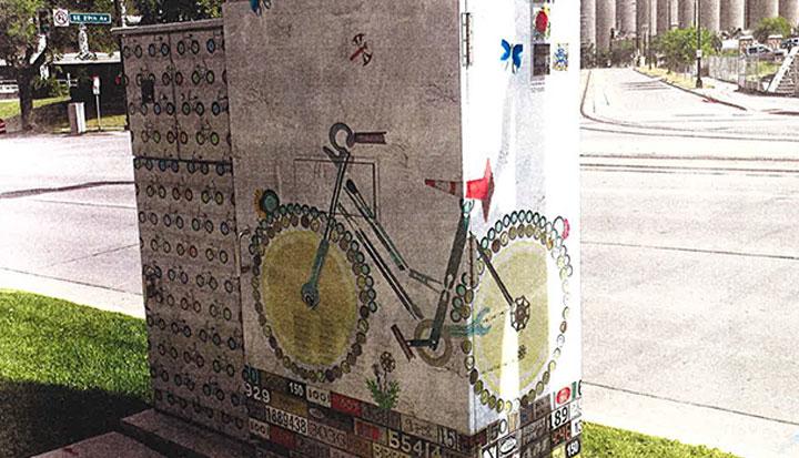 Utility box mural showing a bike